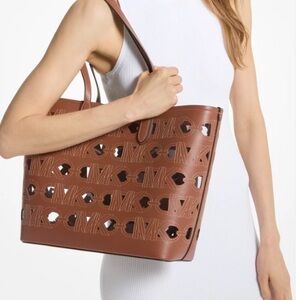 Michael Kors Large Eliza leather tote with cut outs clear liner EUC